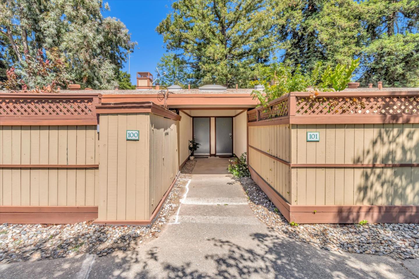 500 West Middlefield Road, Unit 100 Mountain View, CA 94043 - Photo 2 of 47 a view of a house with a wooden fence