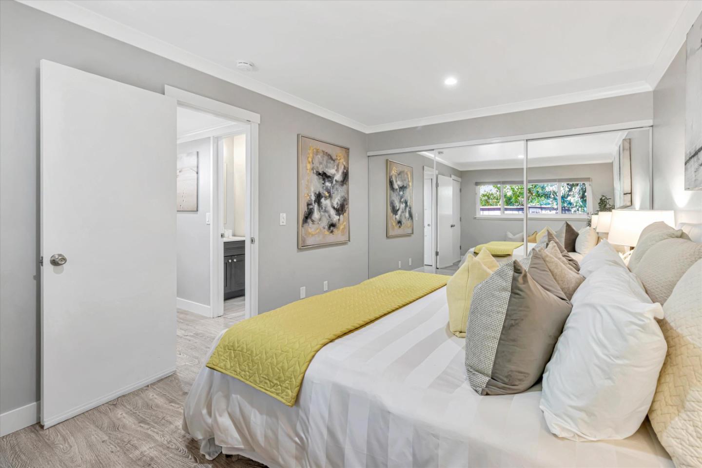 500 West Middlefield Road, Unit 100 Mountain View, CA 94043 - Photo 23 of 47 a bed sitting in a bedroom next to a window