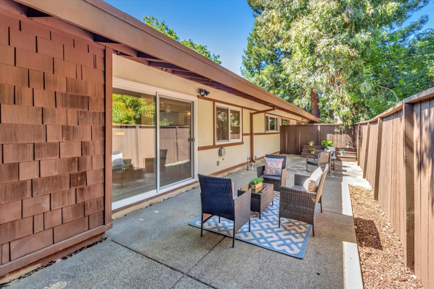 500 West Middlefield Road, Unit 100 Mountain View, CA 94043 - Photo 28 of 47 a outdoor space with patio the couches and a dining table with garden view