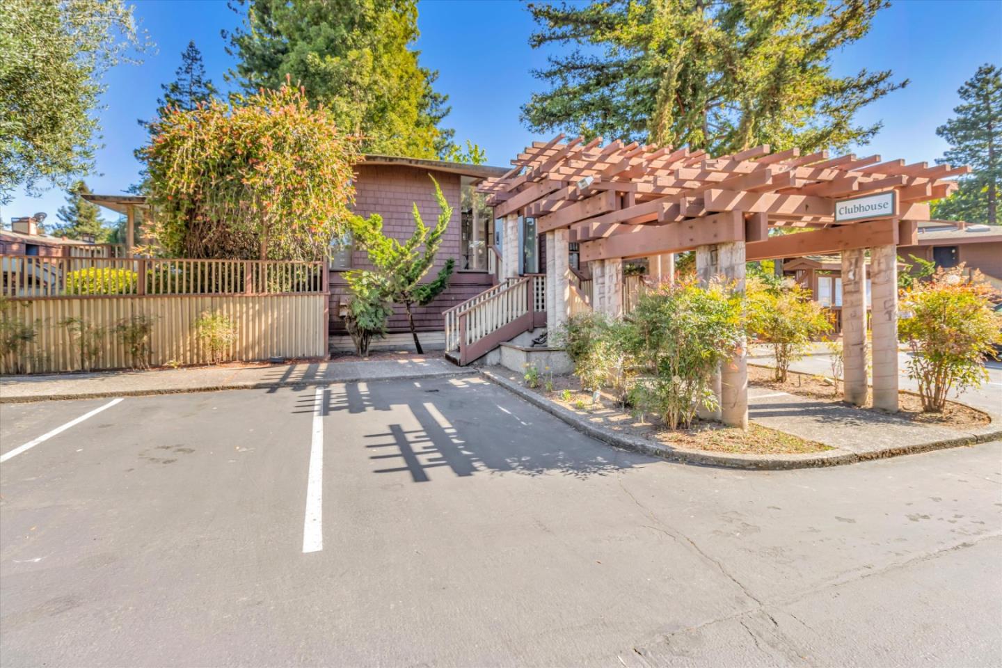 500 West Middlefield Road, Unit 100 Mountain View, CA 94043 - Photo 36 of 47 a view of a white house with a yard and potted plants