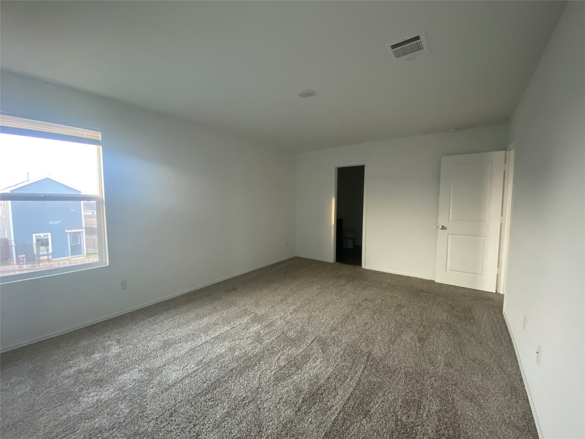 385 Amber Glen Maxwell, TX 78656 - Photo 4 of 8 a view of an empty room with a window