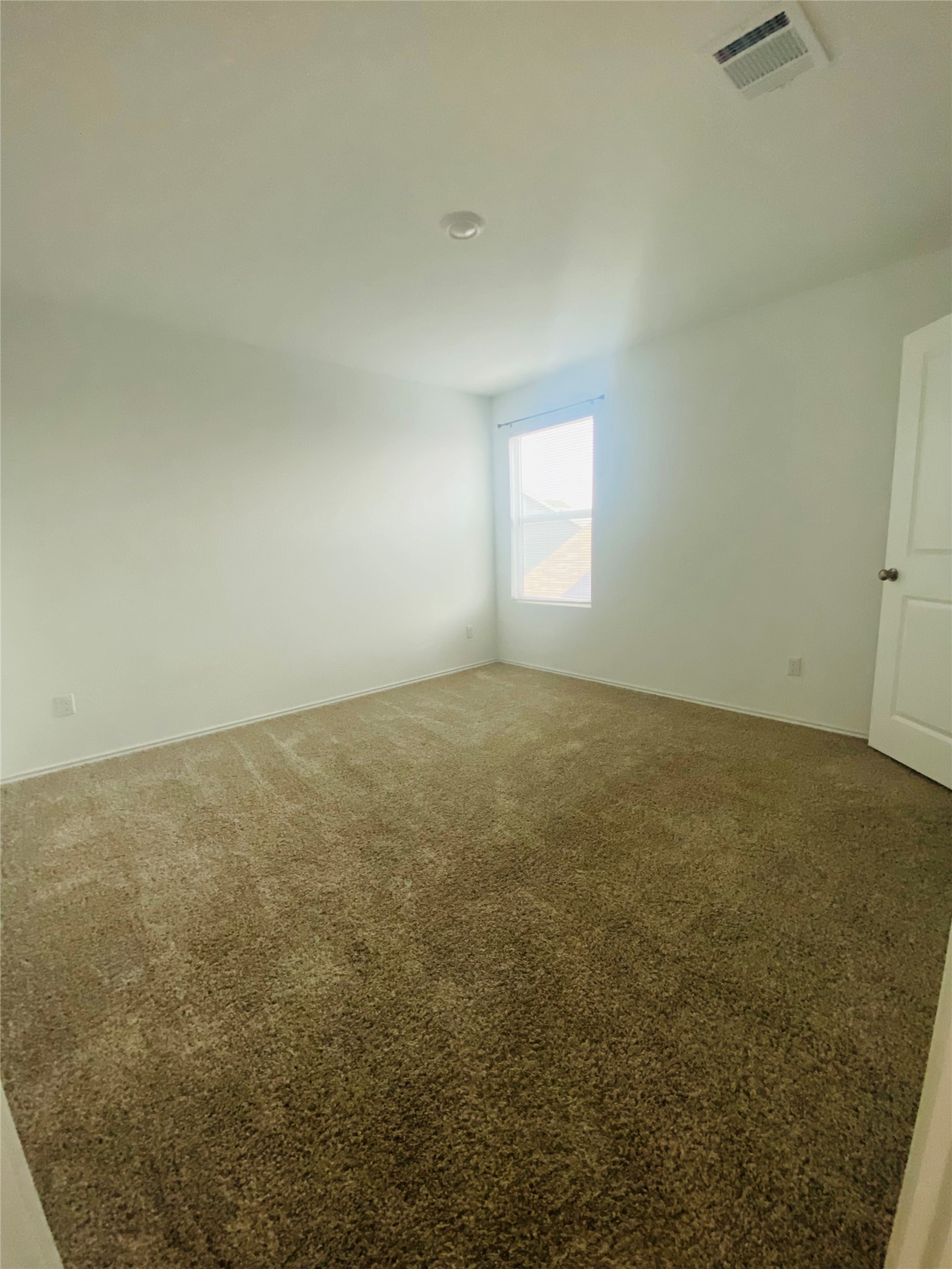 385 Amber Glen Maxwell, TX 78656 - Photo 5 of 8 an empty room with a window