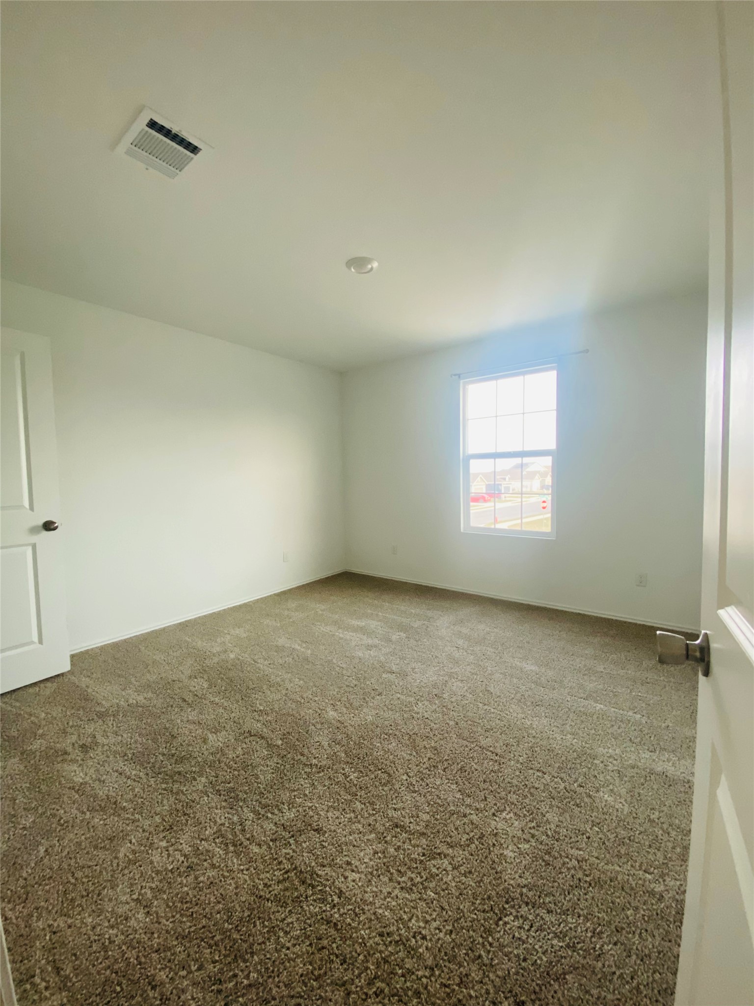 385 Amber Glen Maxwell, TX 78656 - Photo 6 of 8 an empty room with a empty space and windows