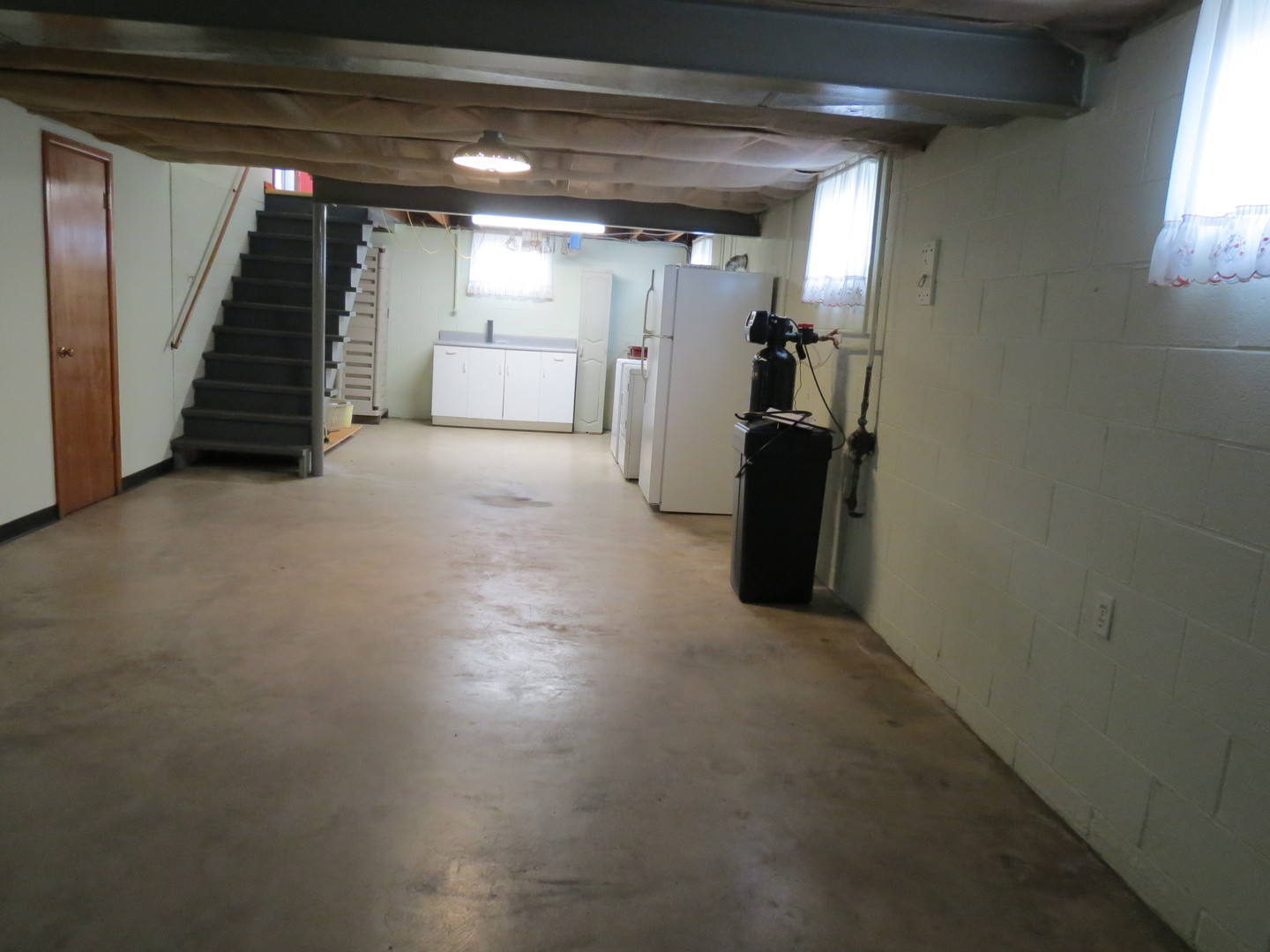 120 East 6th Street Momence, IL 60954 - Photo 18 of 26 a view of empty room with wooden floor and stairs
