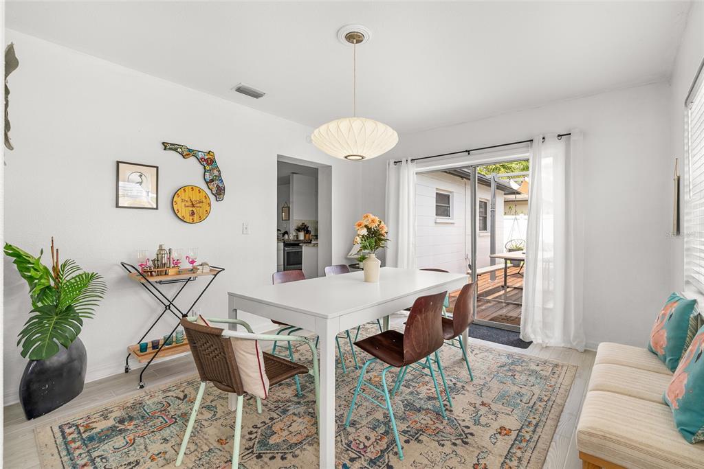 4939 100th Way North St. Petersburg, FL 33708 - Photo 15 of 43 a view of a dining room with furniture and chandelier