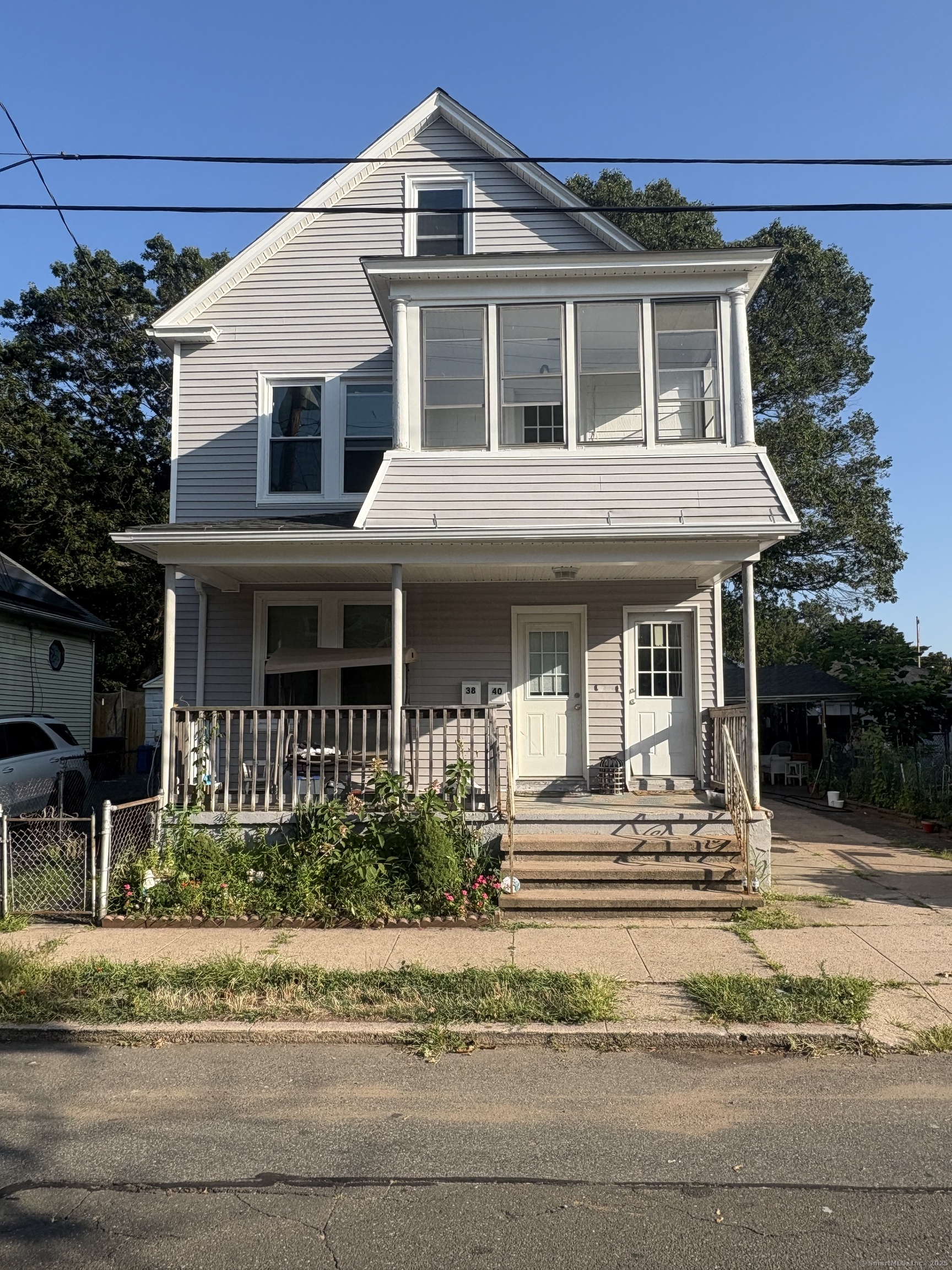 a front view of a house with a porch