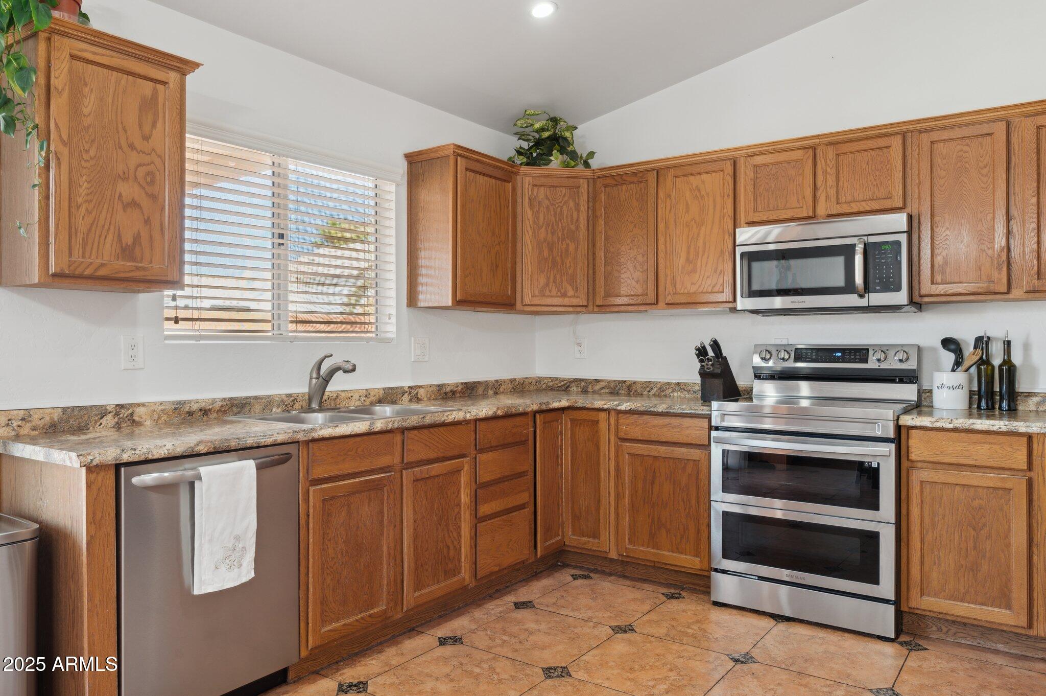 3202 East Decatur Street Mesa, AZ 85213 - Photo 8 of 51 Large kitchen. New range/refrigerator