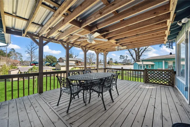 a view of a chairs on wooden deck