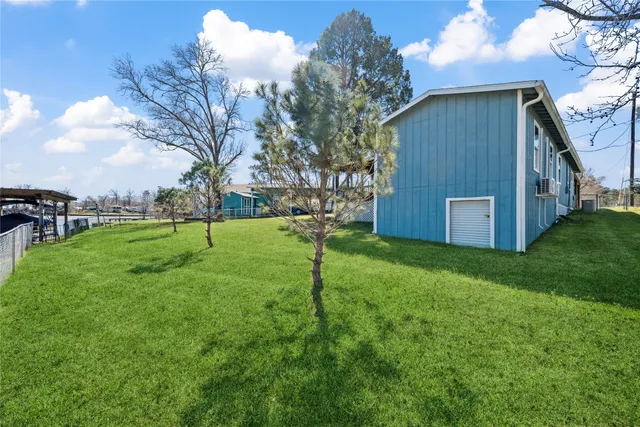 a backyard of a house with lots of green space
