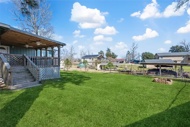 a view of a house with a yard porch and sitting area
