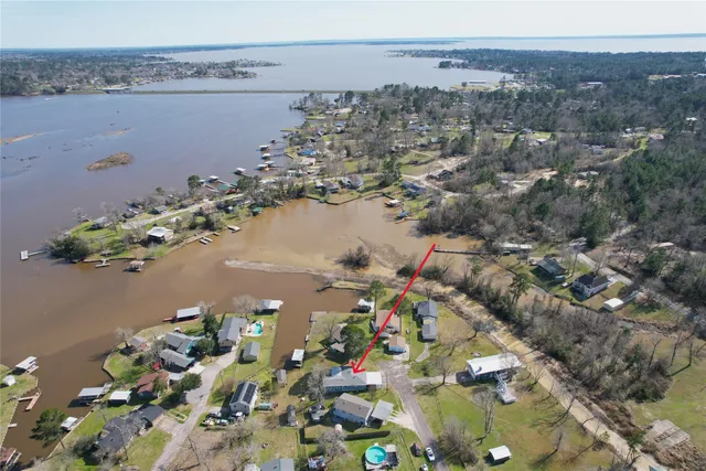an aerial view of a houses with ocean view