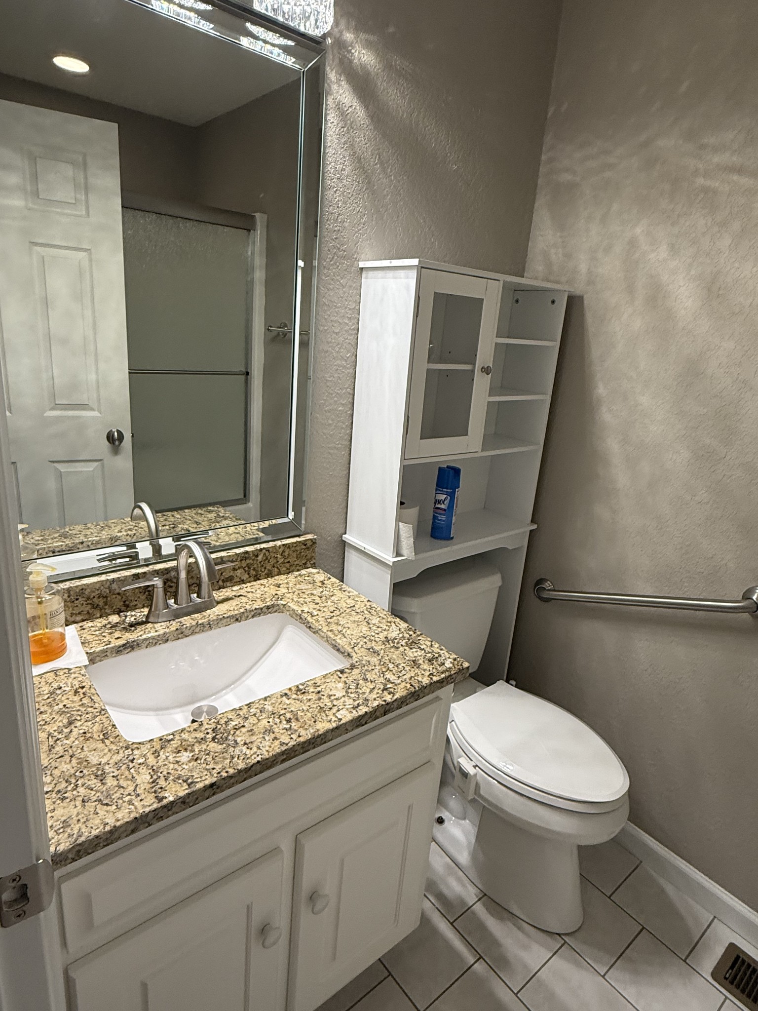 107 Chickory Lane Monteagle, TN 37356 - Photo 25 of 34 a bathroom with a granite countertop sink a mirror and a toilet