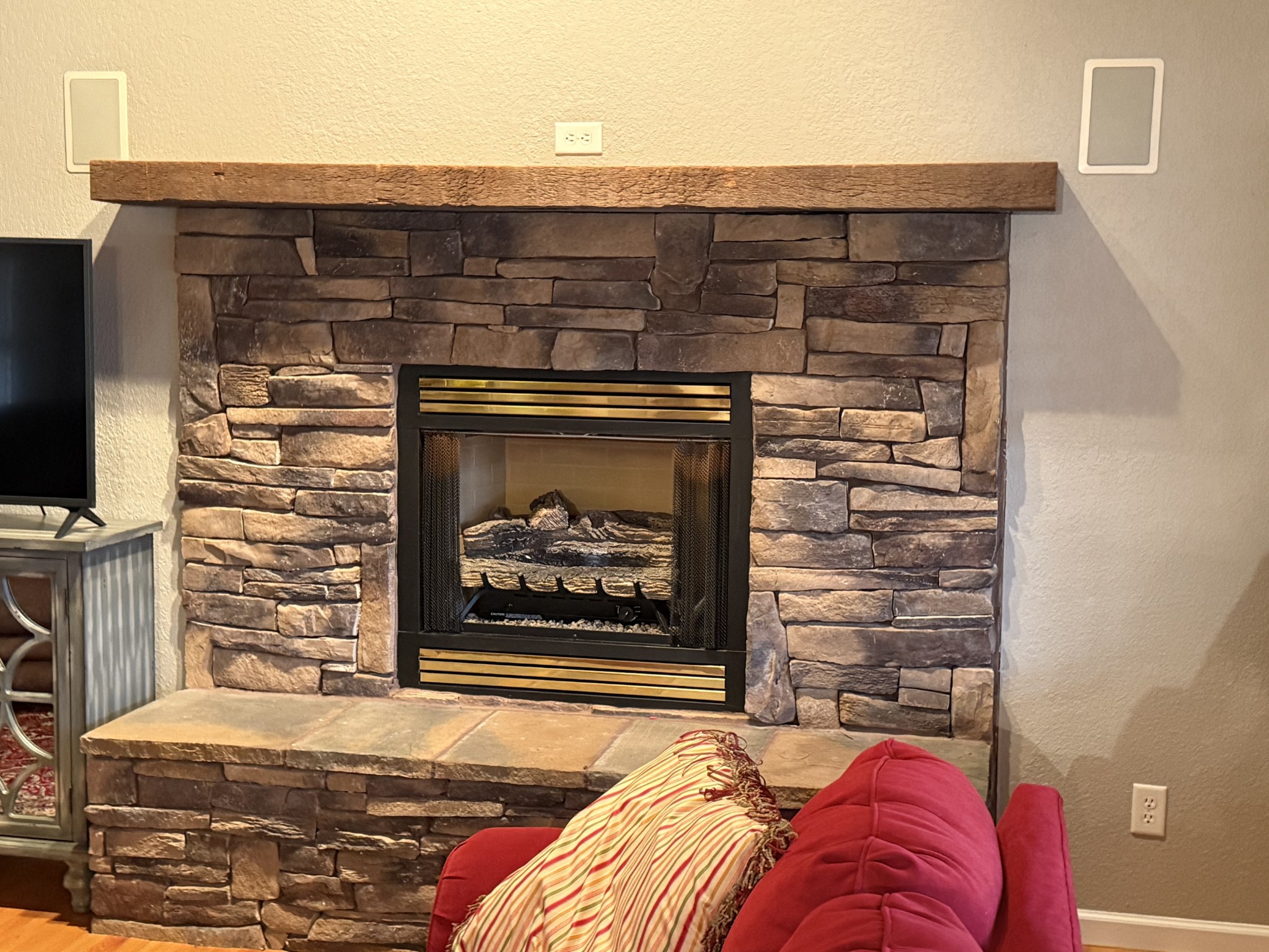 107 Chickory Lane Monteagle, TN 37356 - Photo 29 of 34 a living room with a fireplace and a flat screen tv