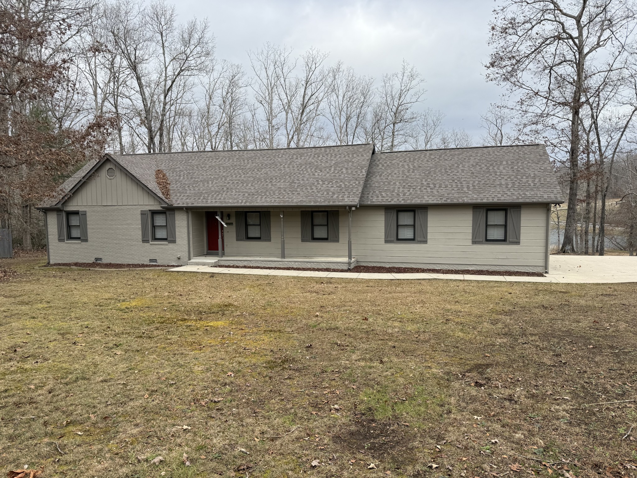 107 Chickory Lane Monteagle, TN 37356 - Photo 3 of 34 a house with trees in front of it