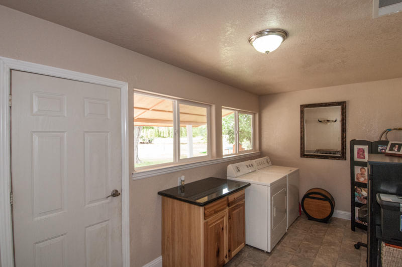 22014 Lone Tree Road Anderson, CA 96007 - Photo 16 of 19 a utility room with sink dryer and washer