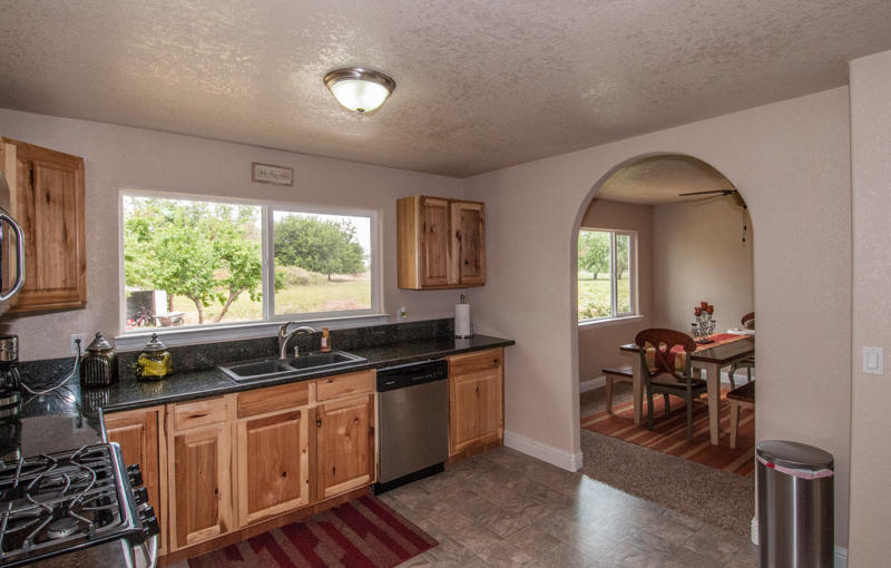 22014 Lone Tree Road Anderson, CA 96007 - Photo 4 of 19 a kitchen with a sink and cabinets