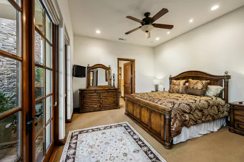 a bathroom with a double vanity sink mirror and shower