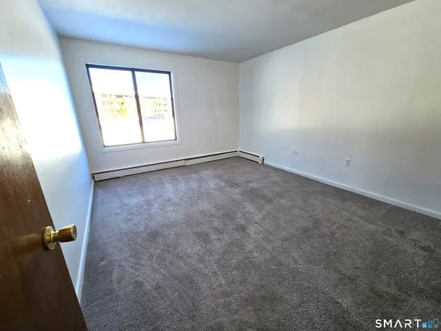 a view of a balcony with wooden floor