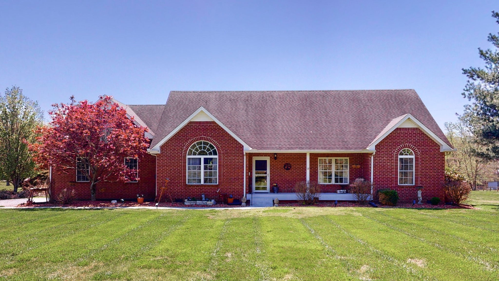 4211 Sandy Springs Road Springfield, TN 37172 - Photo 1 of 58 a front view of a house with a garden
