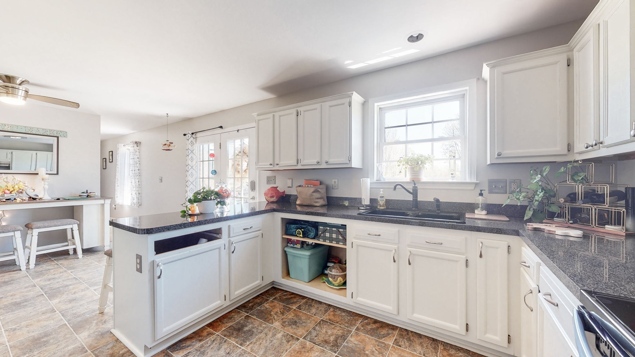 4211 Sandy Springs Road Springfield, TN 37172 - Photo 12 of 58 a kitchen with granite countertop white cabinets sink and appliances
