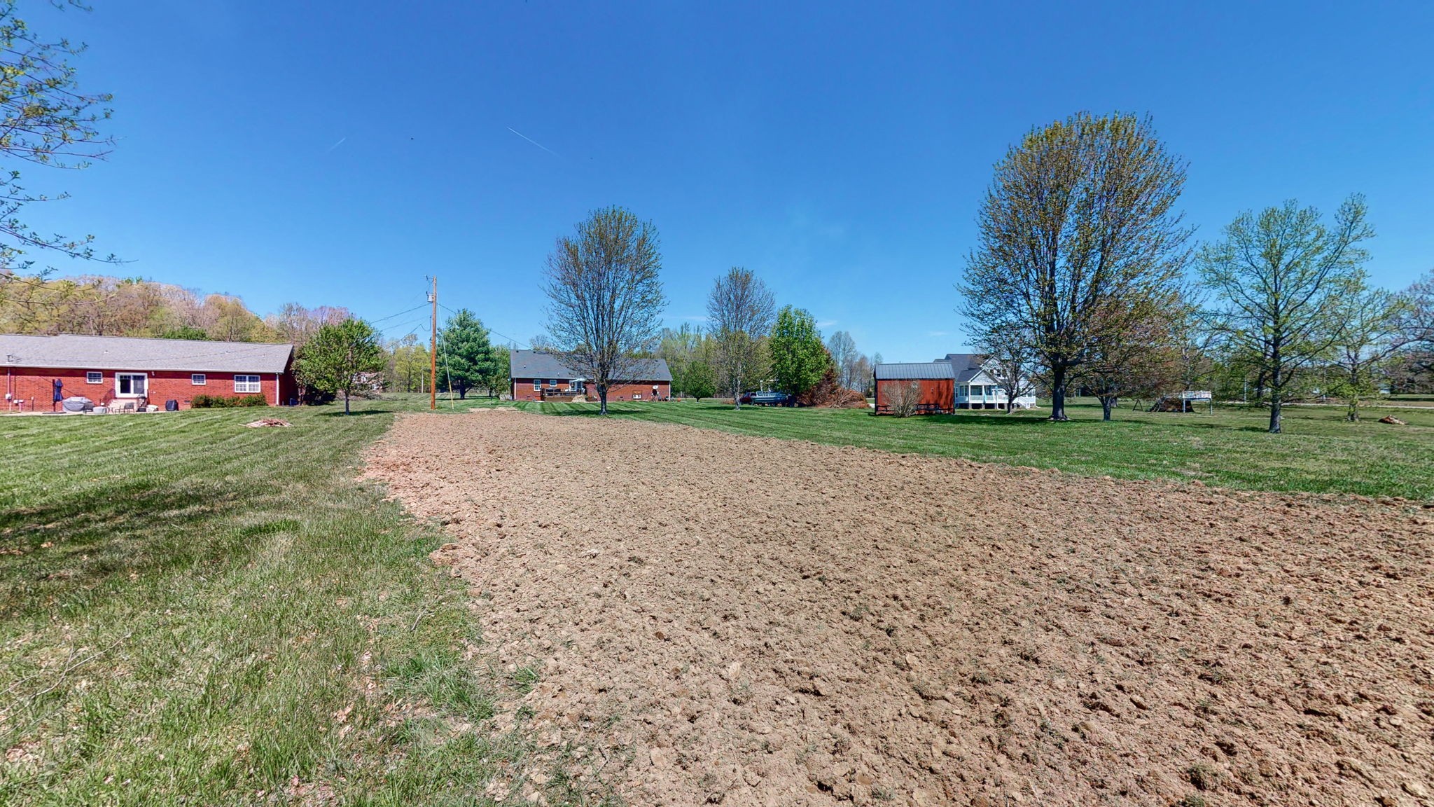 4211 Sandy Springs Road Springfield, TN 37172 - Photo 43 of 58 a view of a park with large trees and a small yard