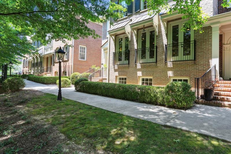 3585 Roxboro Road, Unit 9 Atlanta, GA 30326 - Photo 1 of 1 a view of a brick house with a yard