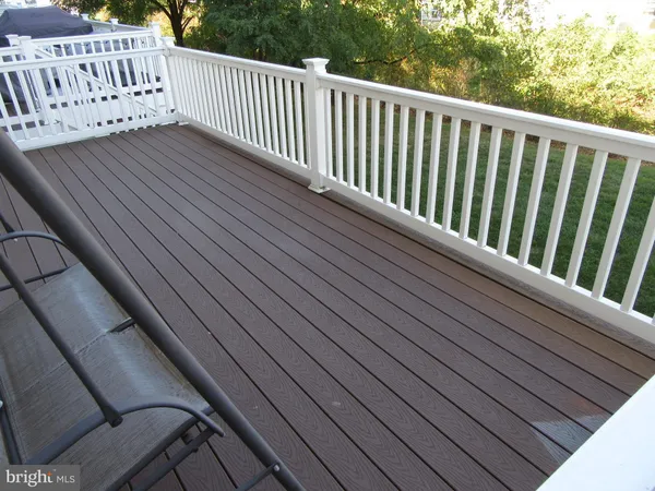 a view of balcony with wooden floor