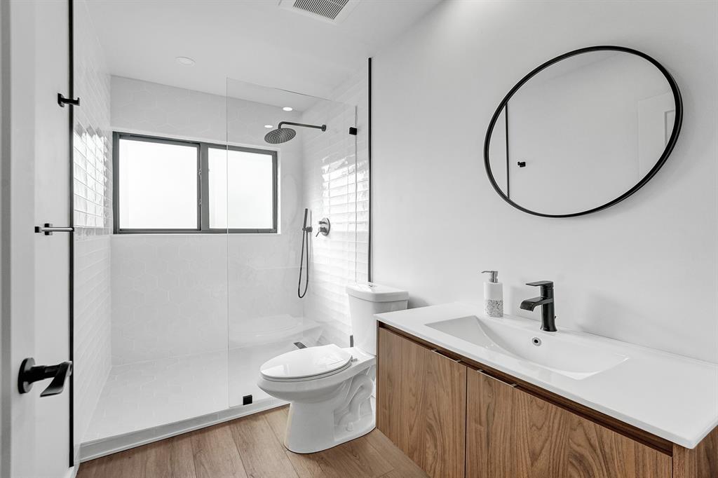 5501 Northeast 18th Terrace Fort Lauderdale, FL 33308 - Photo 20 of 56 a bathroom with a sink a toilet and shower