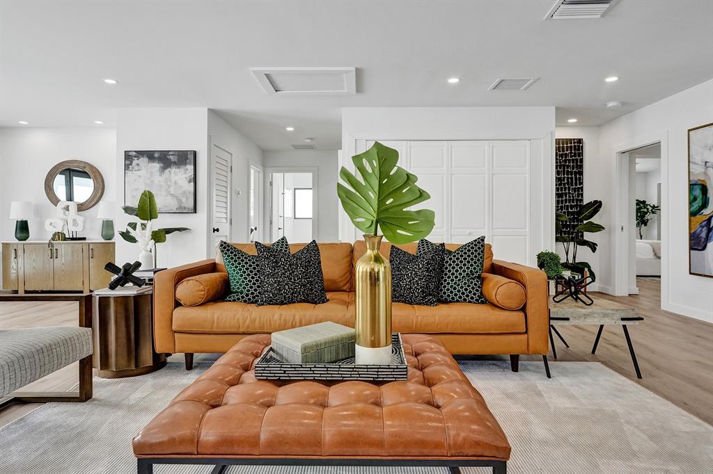 5501 Northeast 18th Terrace Fort Lauderdale, FL 33308 - Photo 2 of 56 a living room with furniture rug and wall paintings