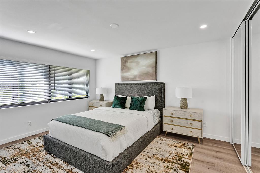 5501 Northeast 18th Terrace Fort Lauderdale, FL 33308 - Photo 23 of 56 a bedroom with a large bed and a window