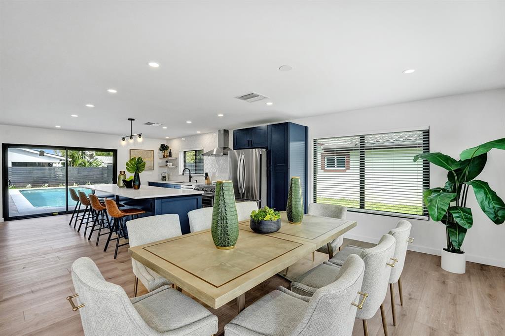 5501 Northeast 18th Terrace Fort Lauderdale, FL 33308 - Photo 26 of 56 a view of a dining room with furniture window and wooden floor