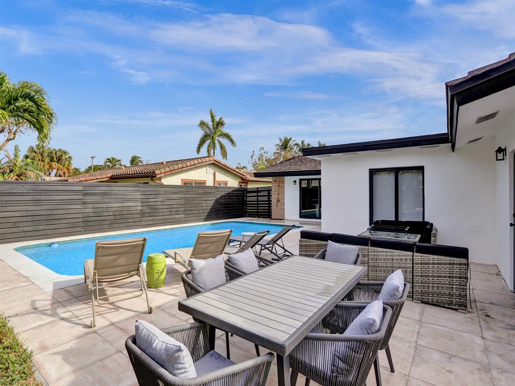 5501 Northeast 18th Terrace Fort Lauderdale, FL 33308 - Photo 28 of 56 a terrace of a house with outdoor seating