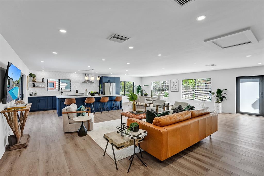 5501 Northeast 18th Terrace Fort Lauderdale, FL 33308 - Photo 30 of 56 a living room with furniture and a flat screen tv