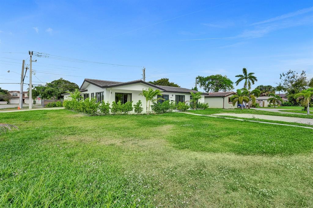 5501 Northeast 18th Terrace Fort Lauderdale, FL 33308 - Photo 43 of 56 a front view of a house with garden