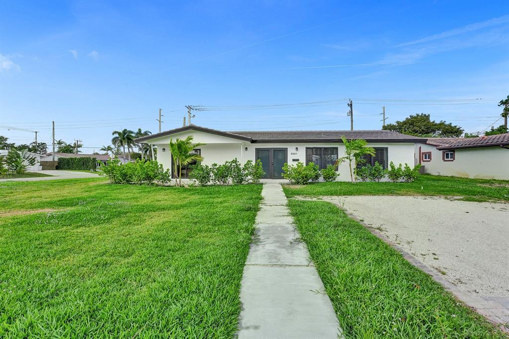 5501 Northeast 18th Terrace Fort Lauderdale, FL 33308 - Photo 44 of 56 a front view of house with yard and green space