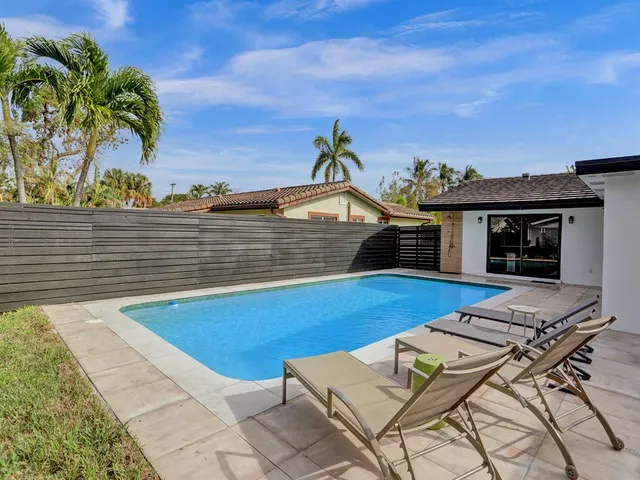 a view of an outdoor sitting area with furniture
