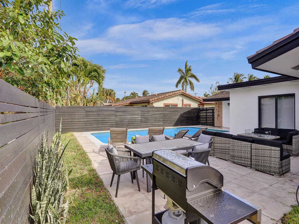 5501 Northeast 18th Terrace Fort Lauderdale, FL 33308 - Photo 55 of 56 a view of an outdoor sitting area with furniture