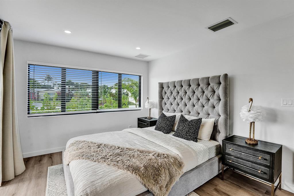 5501 Northeast 18th Terrace Fort Lauderdale, FL 33308 - Photo 6 of 56 a bedroom with a bed and a window