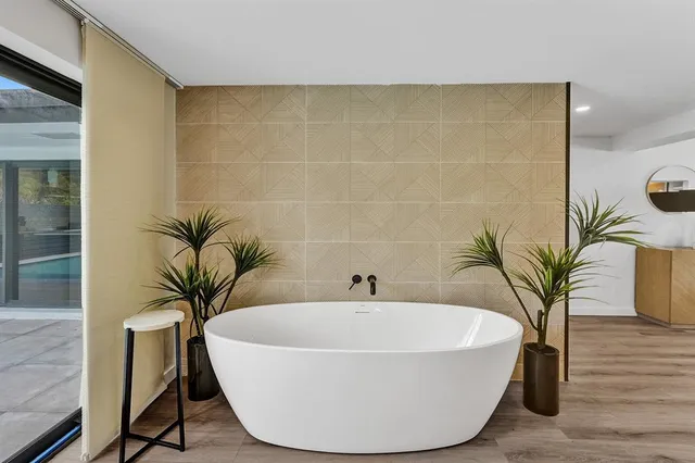 a white bath tub sitting in a bathroom