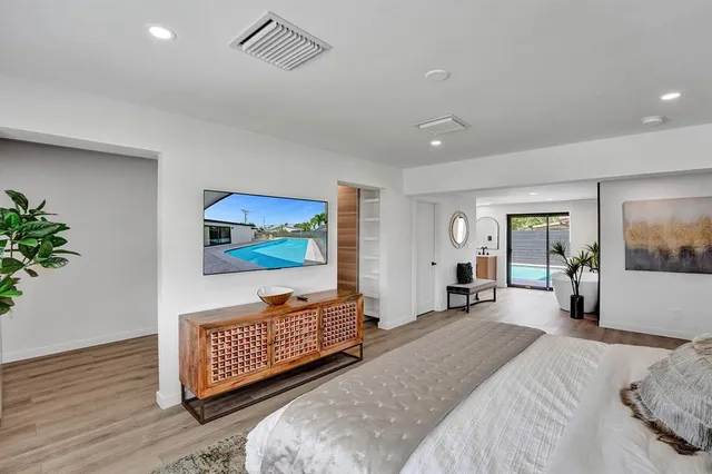 a bedroom with furniture and a window