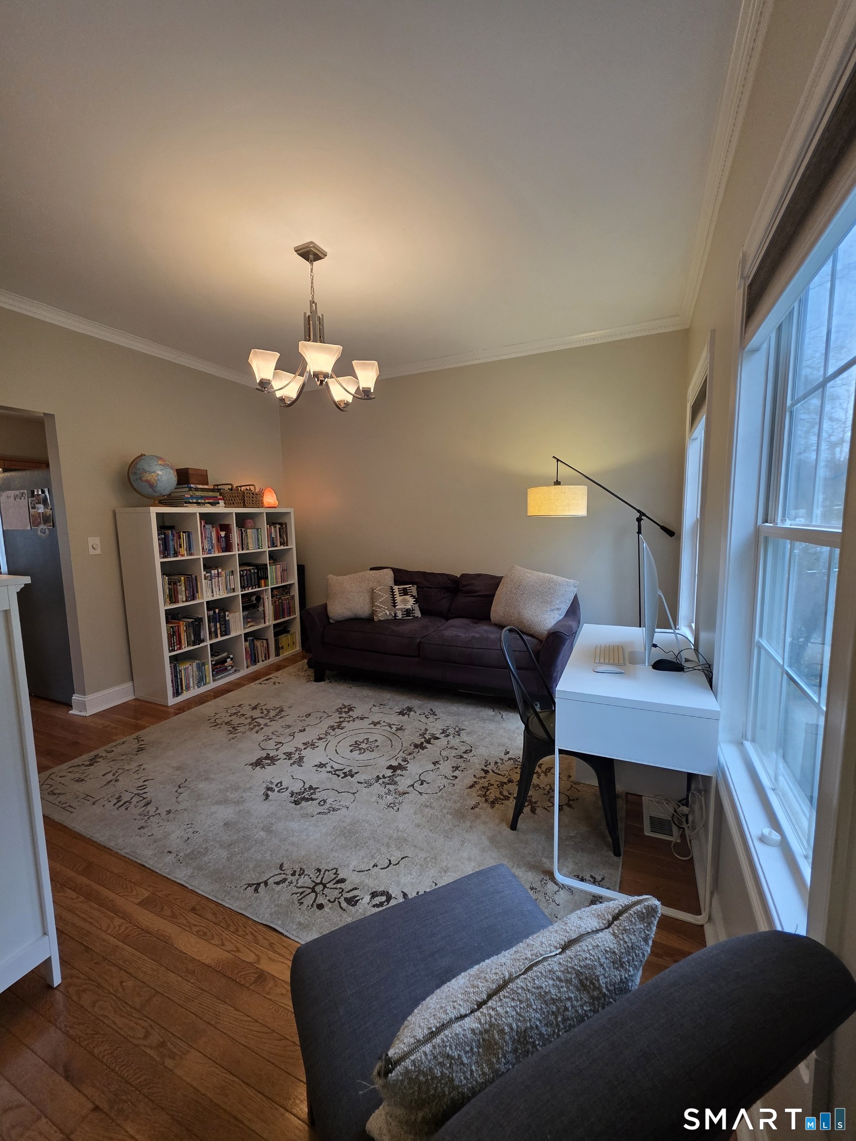 120 Woodbine Road Colchester, CT 06415 - Photo 12 of 24 a living room with furniture and a chandelier