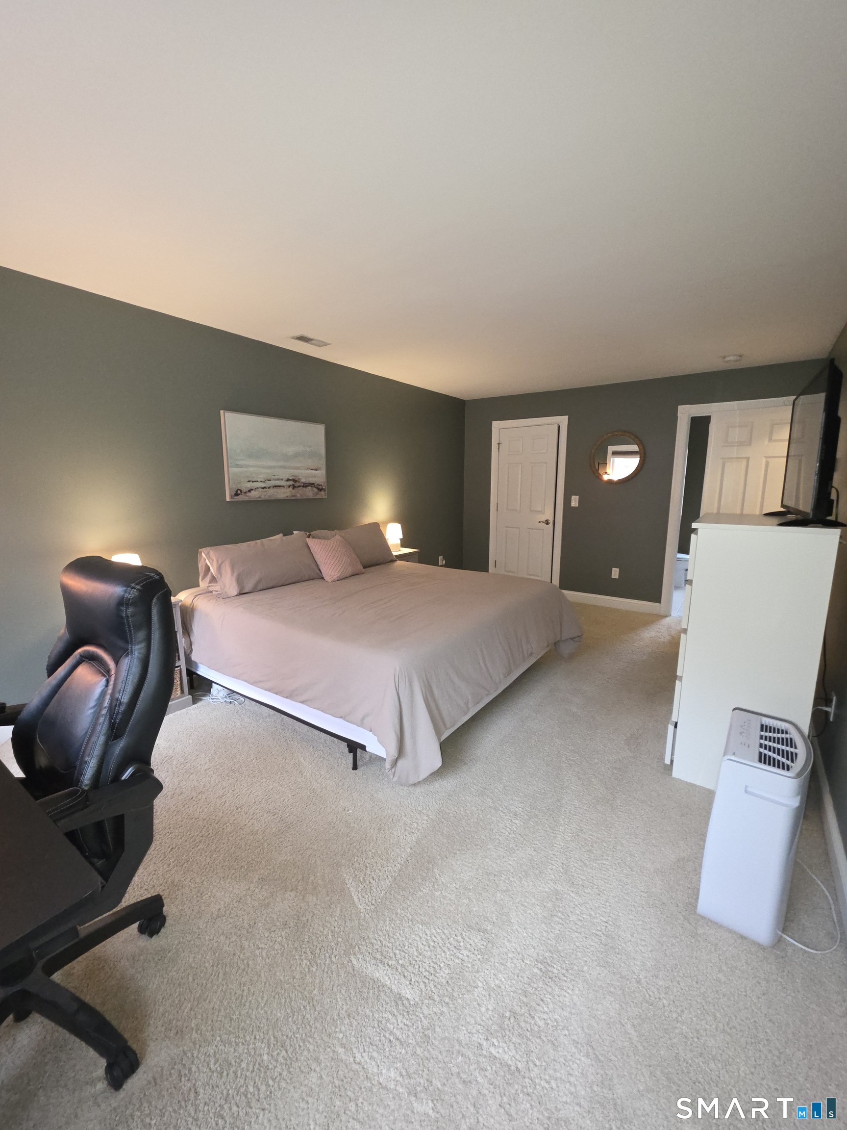 120 Woodbine Road Colchester, CT 06415 - Photo 15 of 24 a bedroom with a bed and lamp