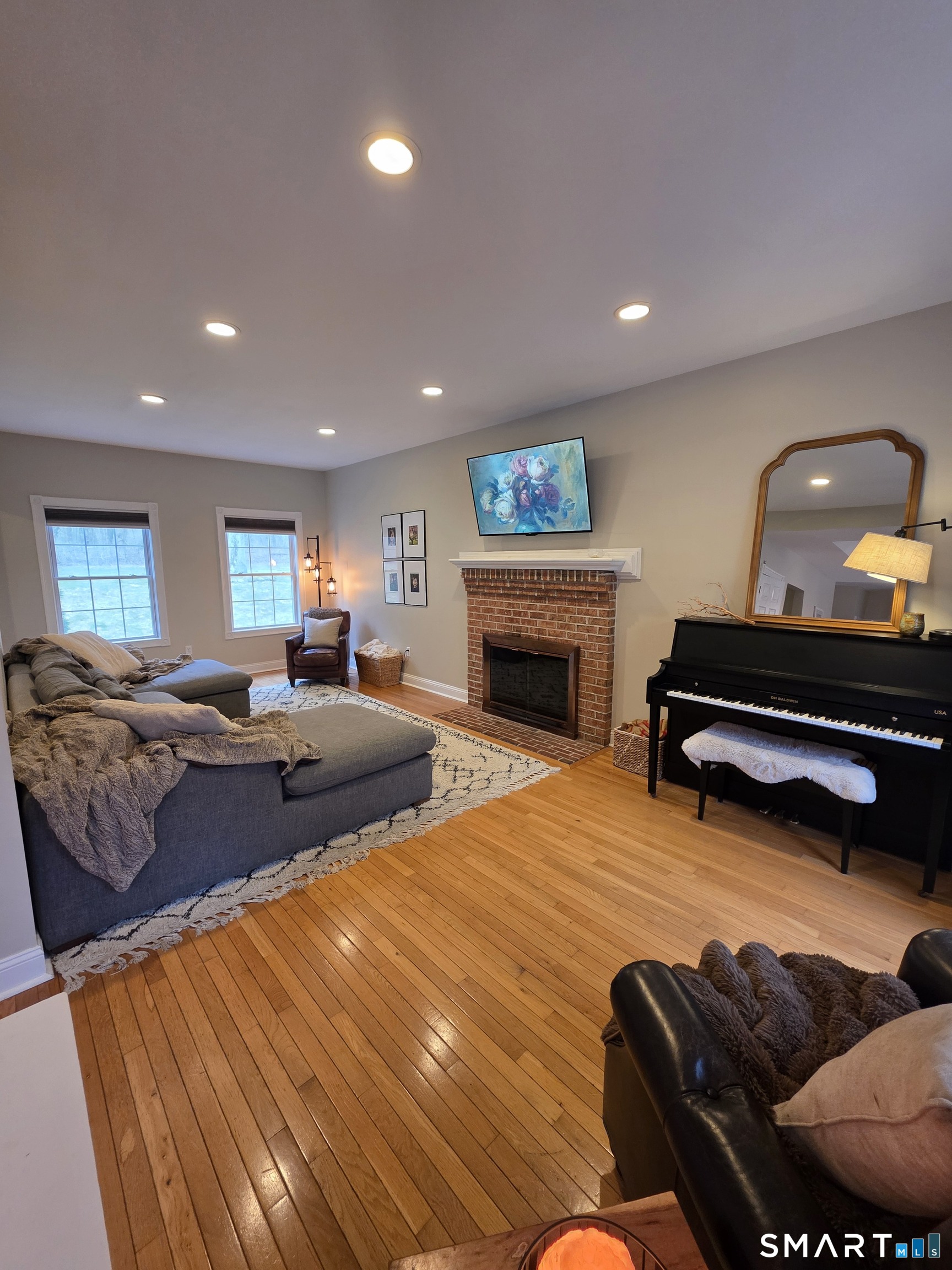 120 Woodbine Road Colchester, CT 06415 - Photo 4 of 24 a living room with furniture and a fireplace