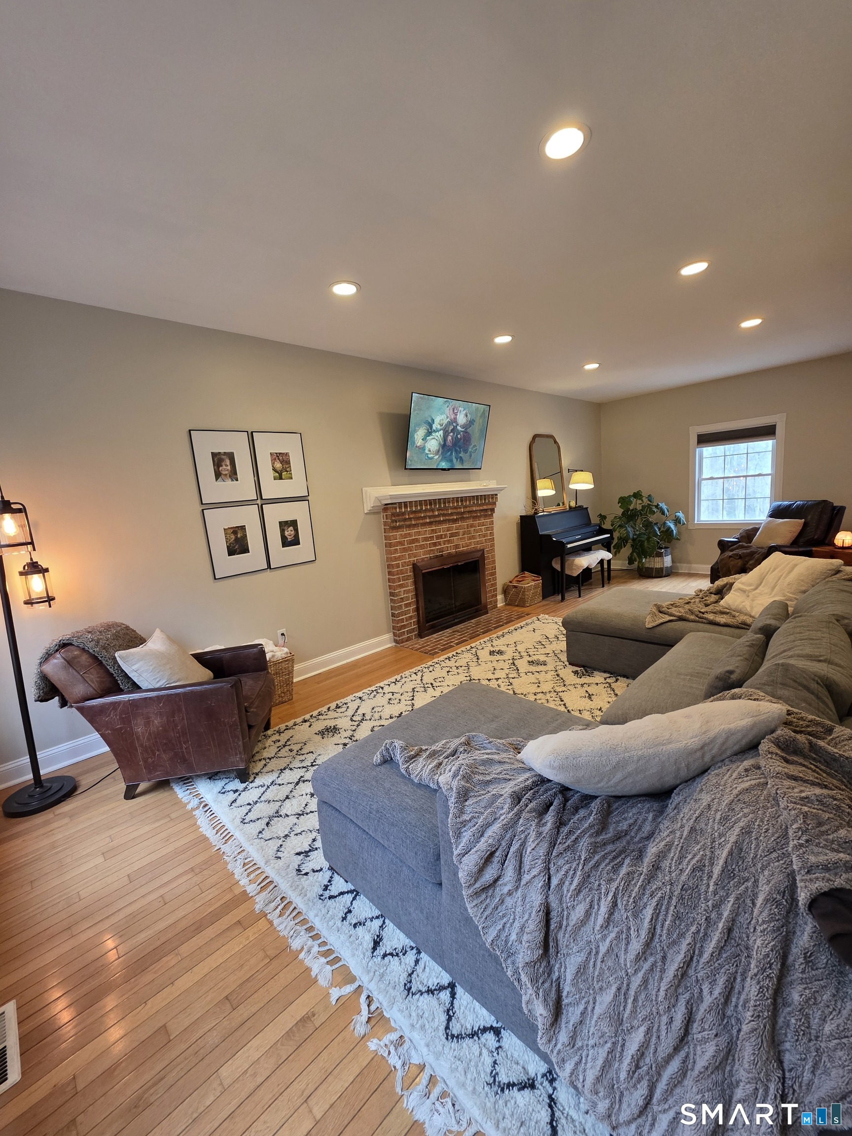 120 Woodbine Road Colchester, CT 06415 - Photo 5 of 24 a living room with furniture or couch and a fireplace