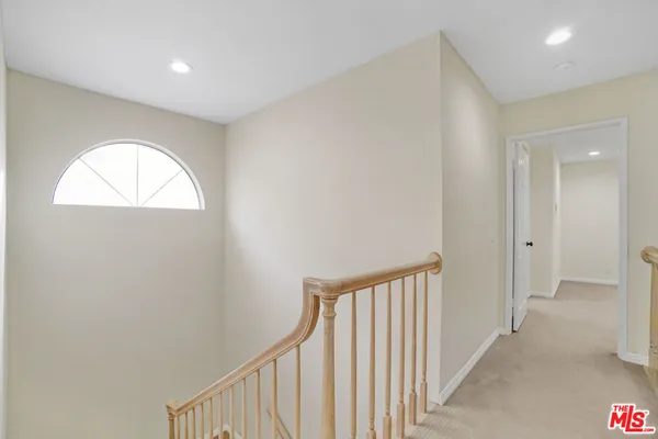 a view of a hallway with a window
