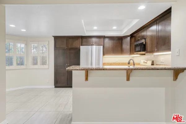 a view of a kitchen with a sink