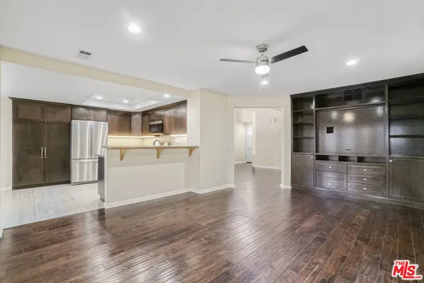 a view of a livingroom with wooden floor
