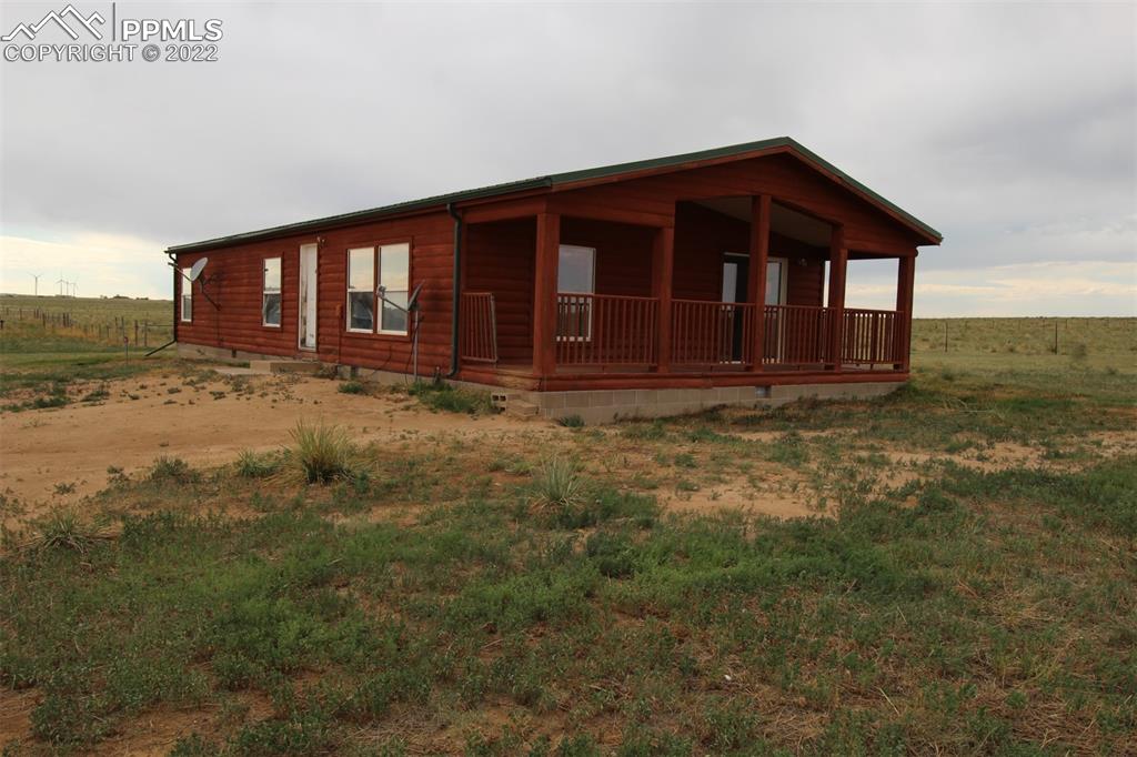 6550 Sengbeil Road Calhan, CO 80808 - Photo 1 of 21 a view of a house with a yard