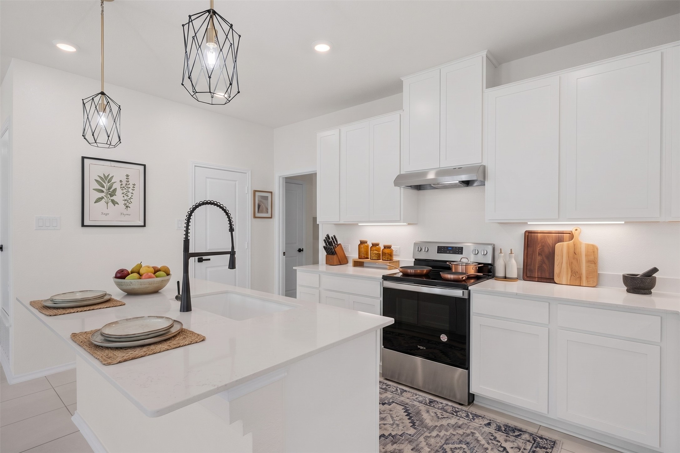 15100 Garrano Way Manor, TX 78653 - Photo 13 of 34 **Virtually Staged Photo of Kitchen**