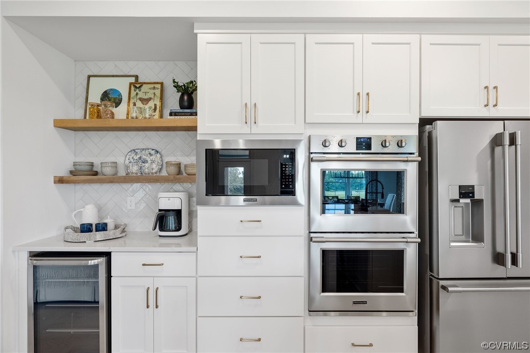 15124 Heaton Drive Midlothian, VA 23112 - Photo 12 of 49 a kitchen with white cabinets and appliances